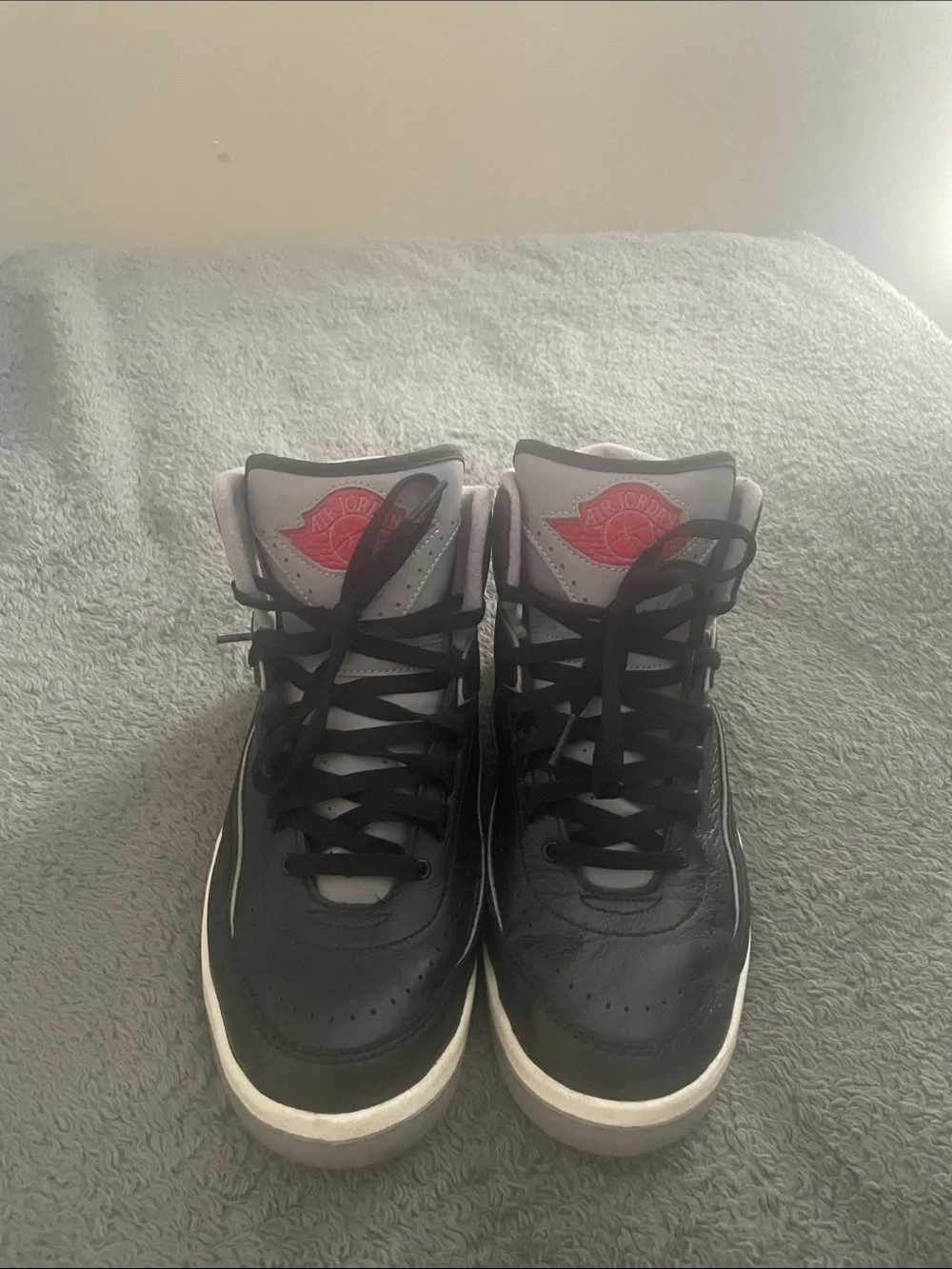 Jordan Men's Black and Gray High-Top Sneakers with Red Accent